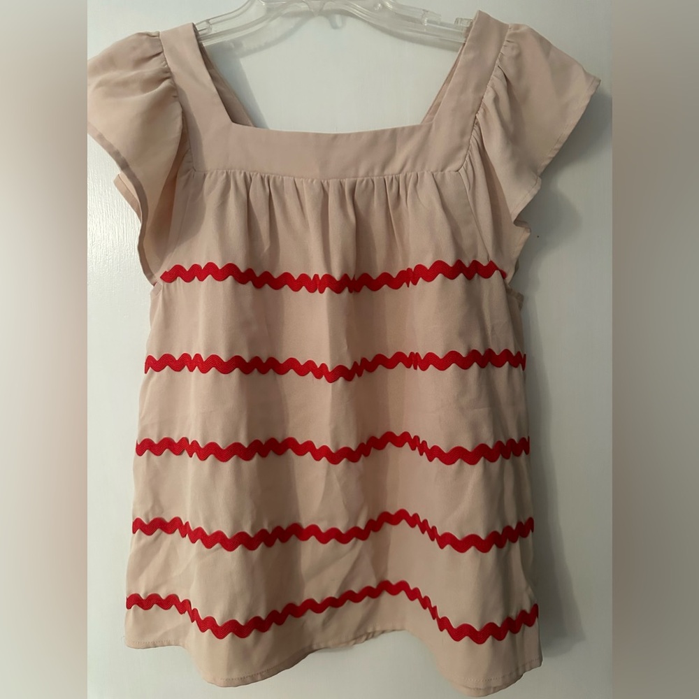 Khaki shirt with red decor